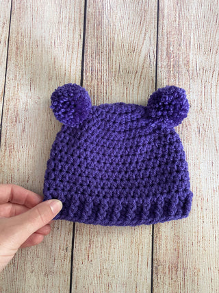 Purple mini pom pom hat by Two Seaside Babes