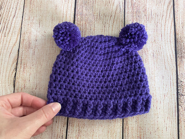 Purple mini pom pom hat