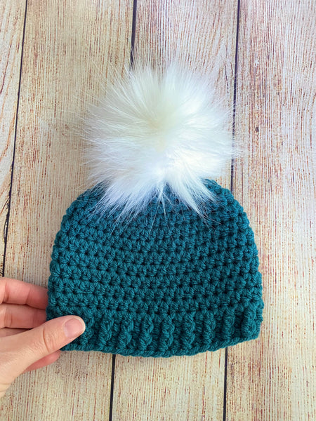 Teal faux fur pom pom hat by Two Seaside Babes