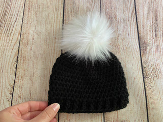 Black faux fur pom pom hat