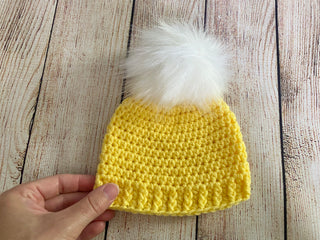 Yellow faux fur pom pom hat